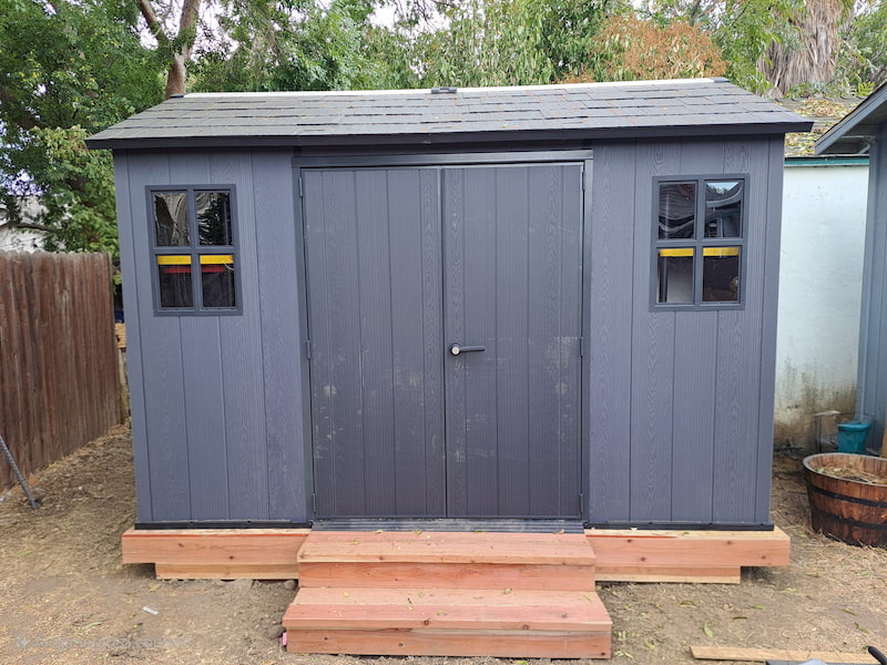 Completed Keter shed on custom wooden foundation